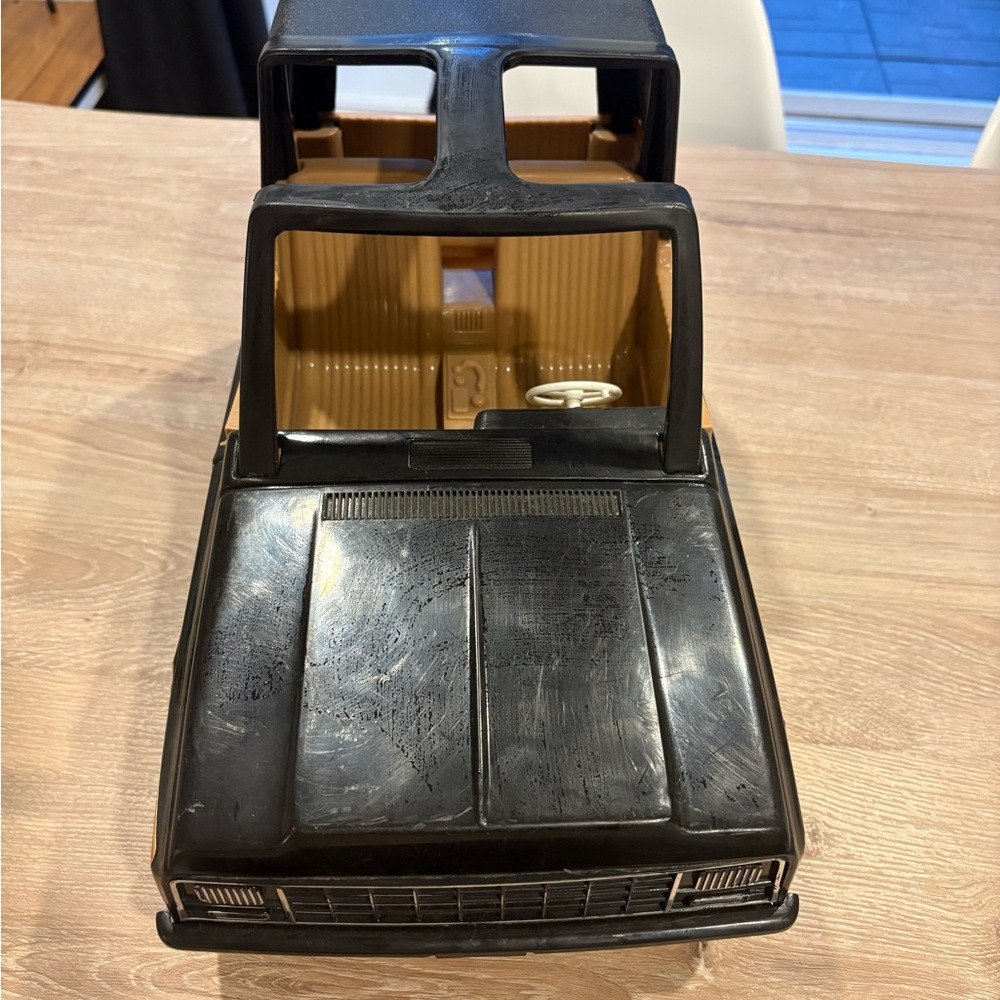 Black and Tan Toy Car Model